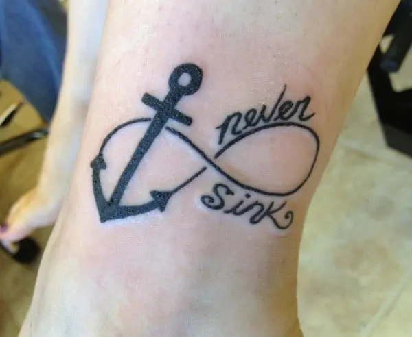 quote with anchor design tattoo on wrist