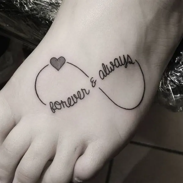 quote with heart tattoo on foot