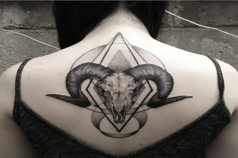 aries ram skull tattoo on back