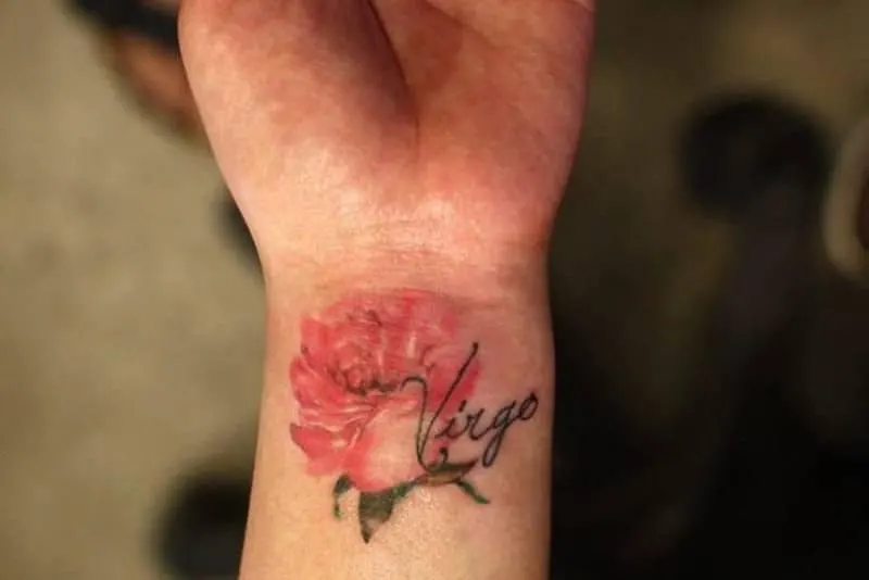 red rose tattoo with Virgo word on the wrist