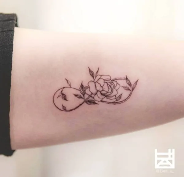 rose design tattoo on arm