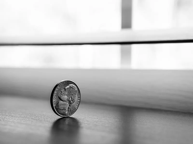 round silver coin on the table