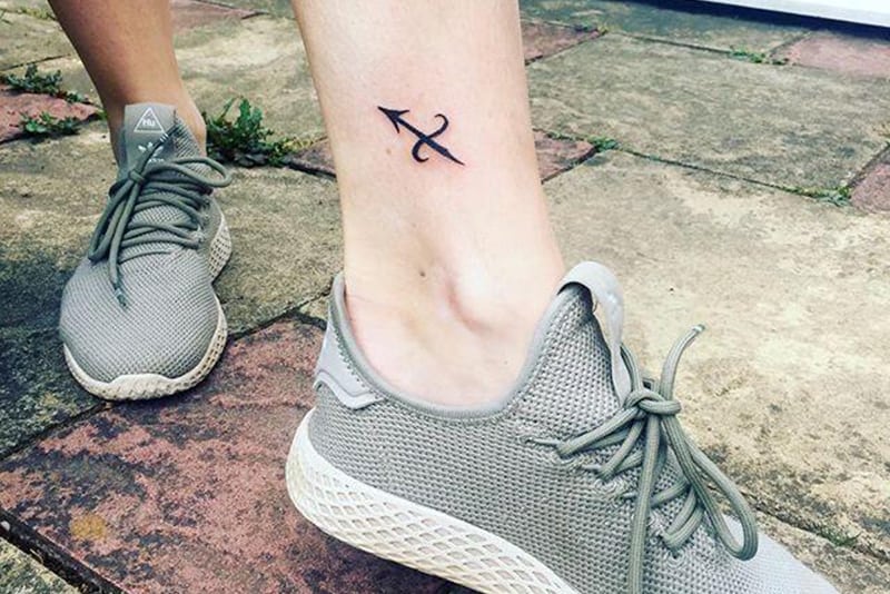 sagittarius symbol tattoo above the ankle