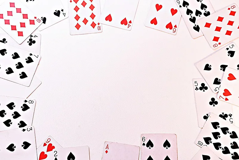 scattered playing cards in rectangle frame on white background