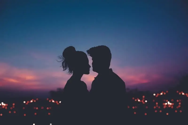 silhouette of man and woman making eye contact