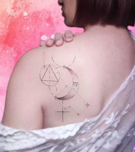 simple and minimalist Virgo constellation tattoo with moon and triangle on the back