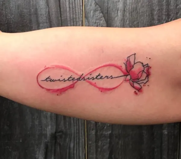 sister tattoo in a pink sign with a flower