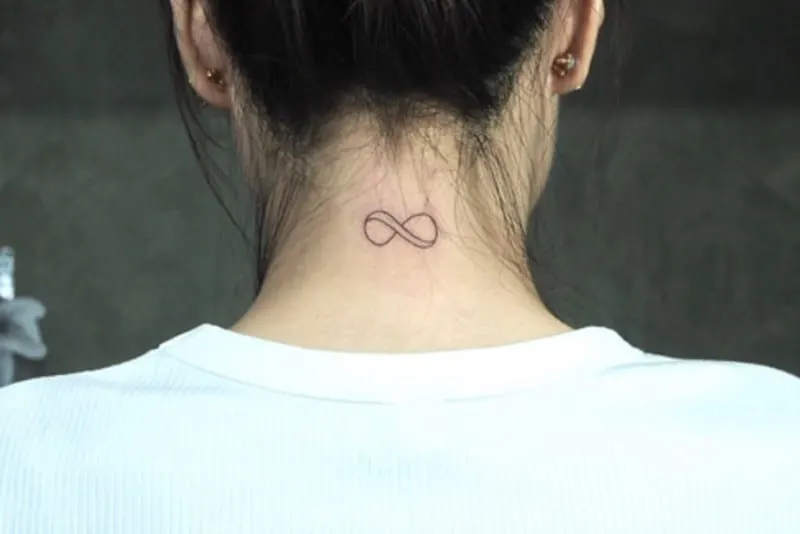 small infinity tattoo on neck