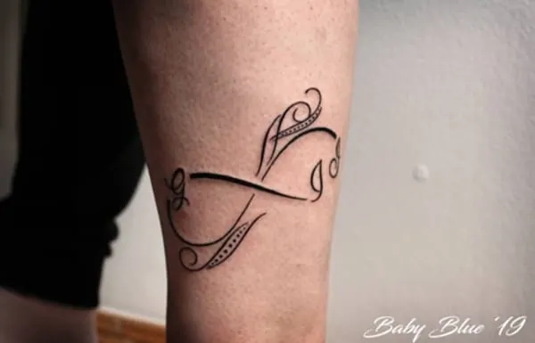 swirly design tattoo on arm