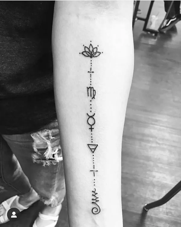 symbols connected with dots tattoo on the arm