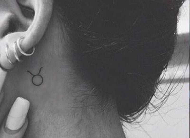 taurus symbol tattoo behind the ear