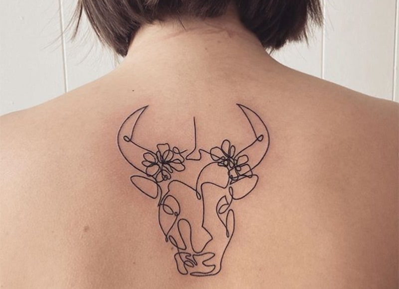 taurus tattoo with thin lines on the back