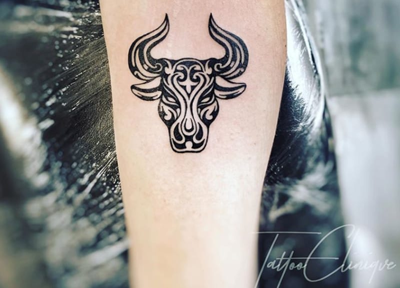 taurus tribal tattoo on the arm