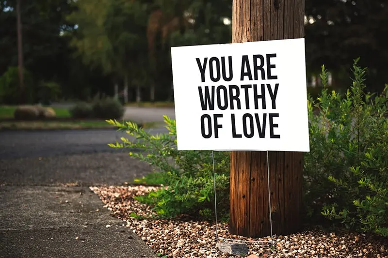 the board with a message you are worthy of love