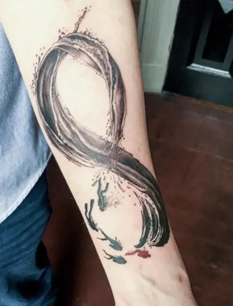 water with fishes tattoo on arm