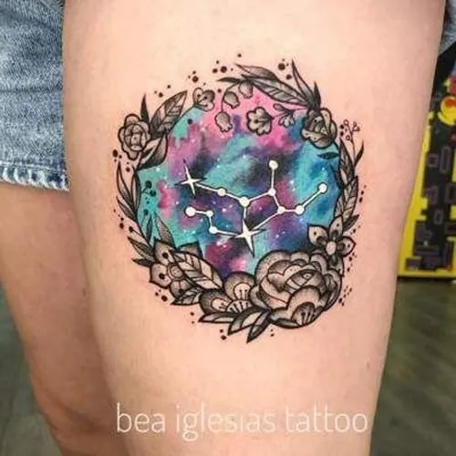 watercolor Virgo constellation tattoo inside a flower wreath