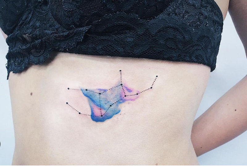 watercolor Virgo constellation tattoo on the ribs