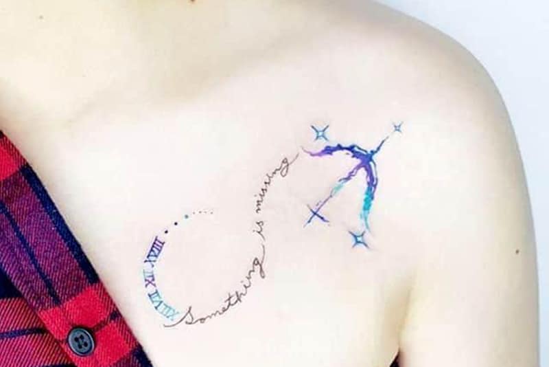 watercolor bow tattoo on the chests