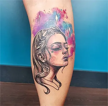 watercolor tattoo with a portrait of a woman wearing a Virgo earring