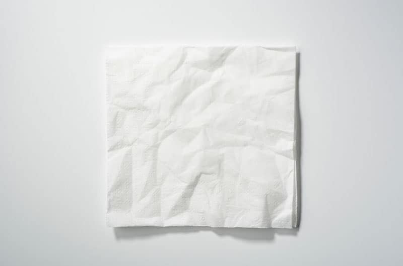 white crumpled paper smoothen placed on white background