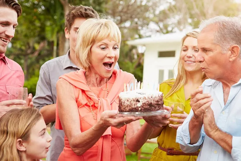 woman celebrating birthday with her family
