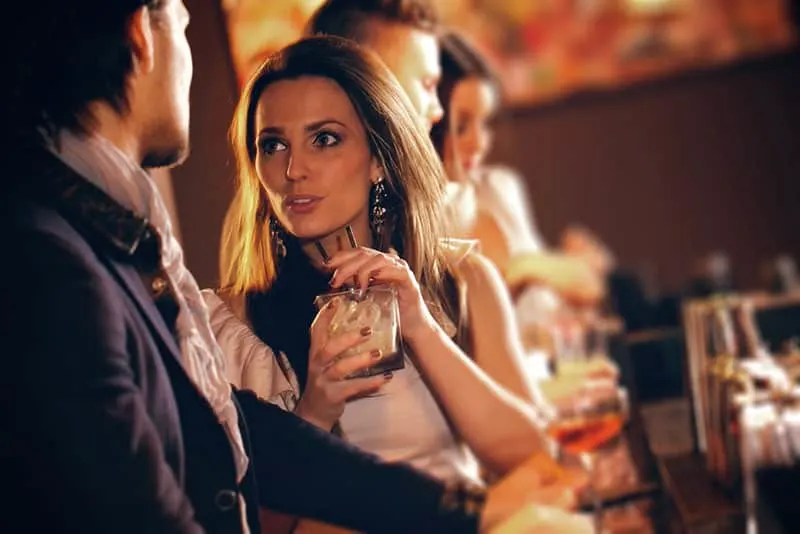 woman flirting with man in the bar