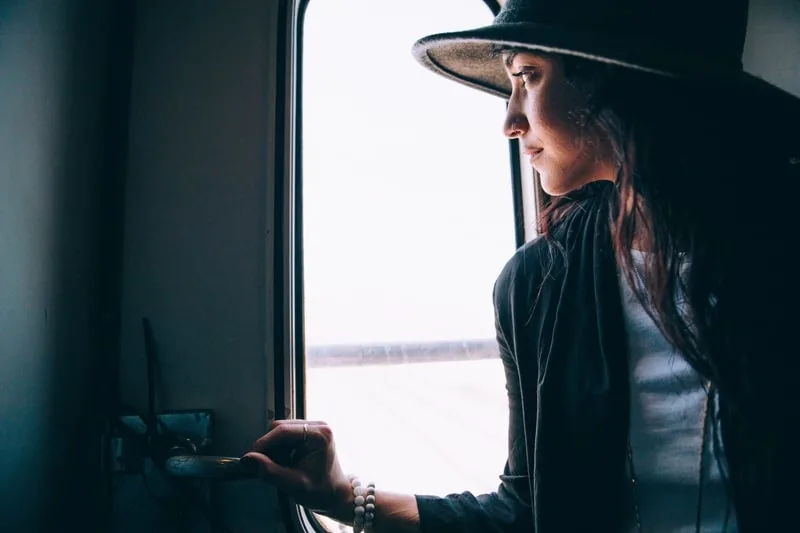 woman in hat near the door