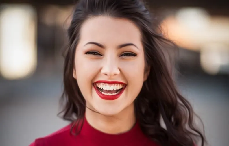 Woman in red top laughing