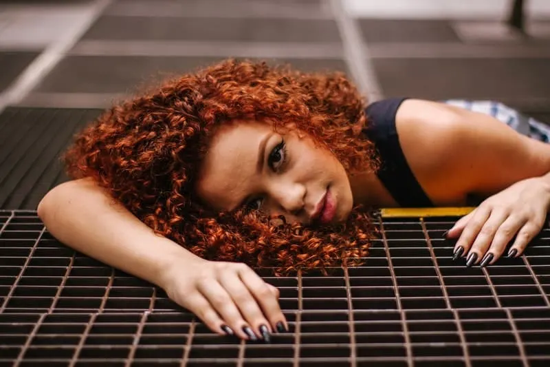 woman laying on rubber mat