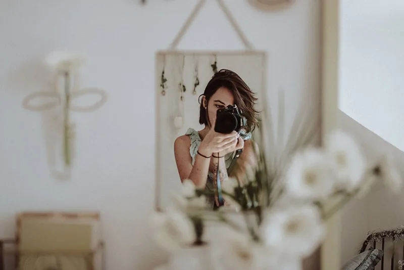 Woman selfie camera shot mirror reflection