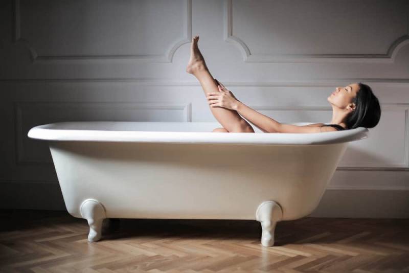 woman relaxing in bathtub