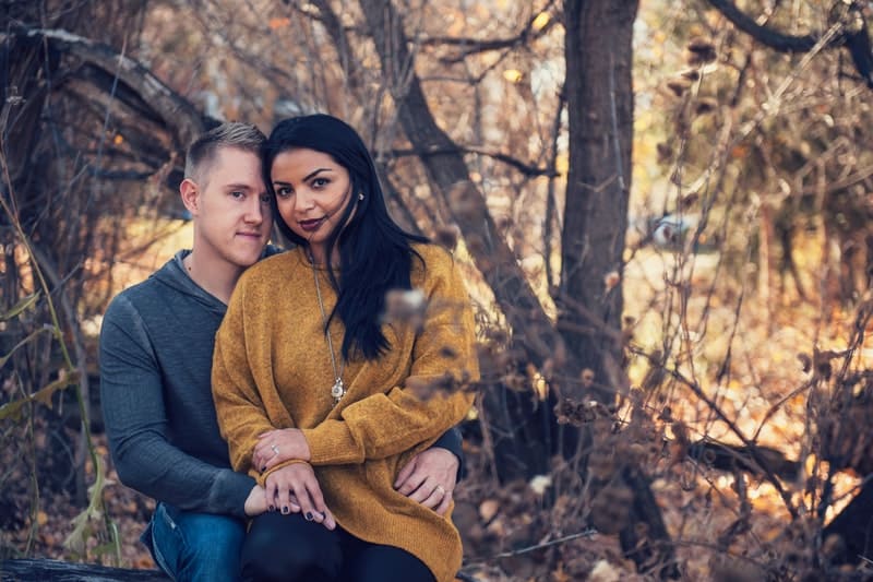 woman sitting in man's lap