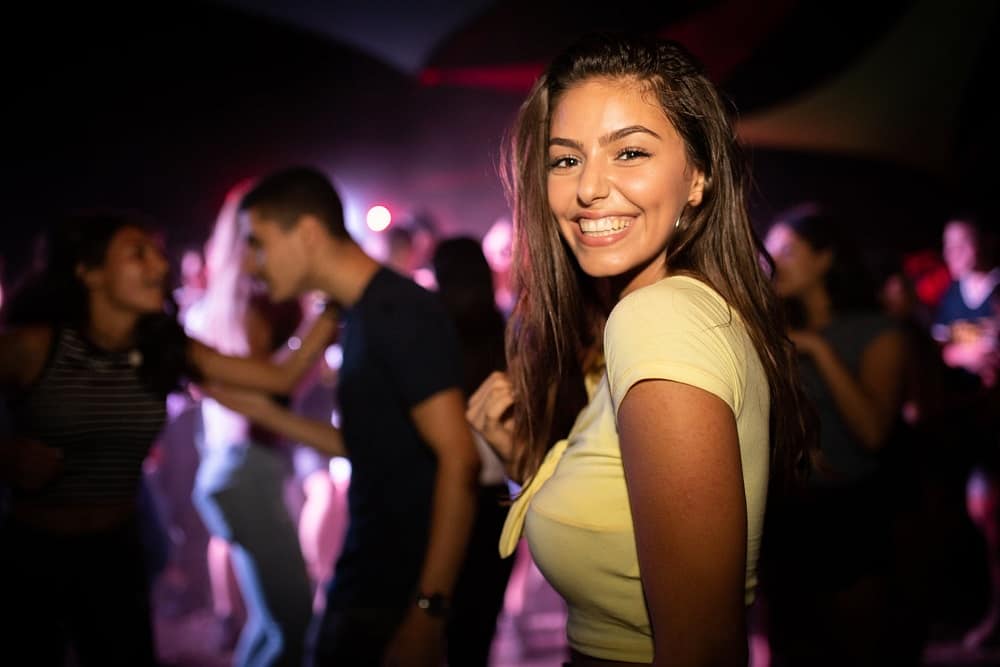 woman standing near group of people at the party