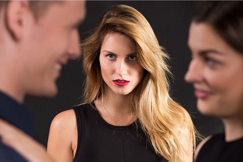 woman staring at two couple talking in blur