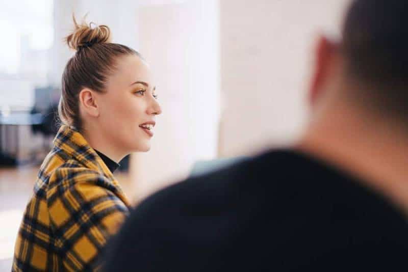 woman wearing yellow black plaid shirt