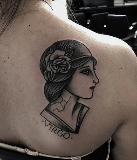 woman`s portrait with Virgo symbolism tattoo on the back