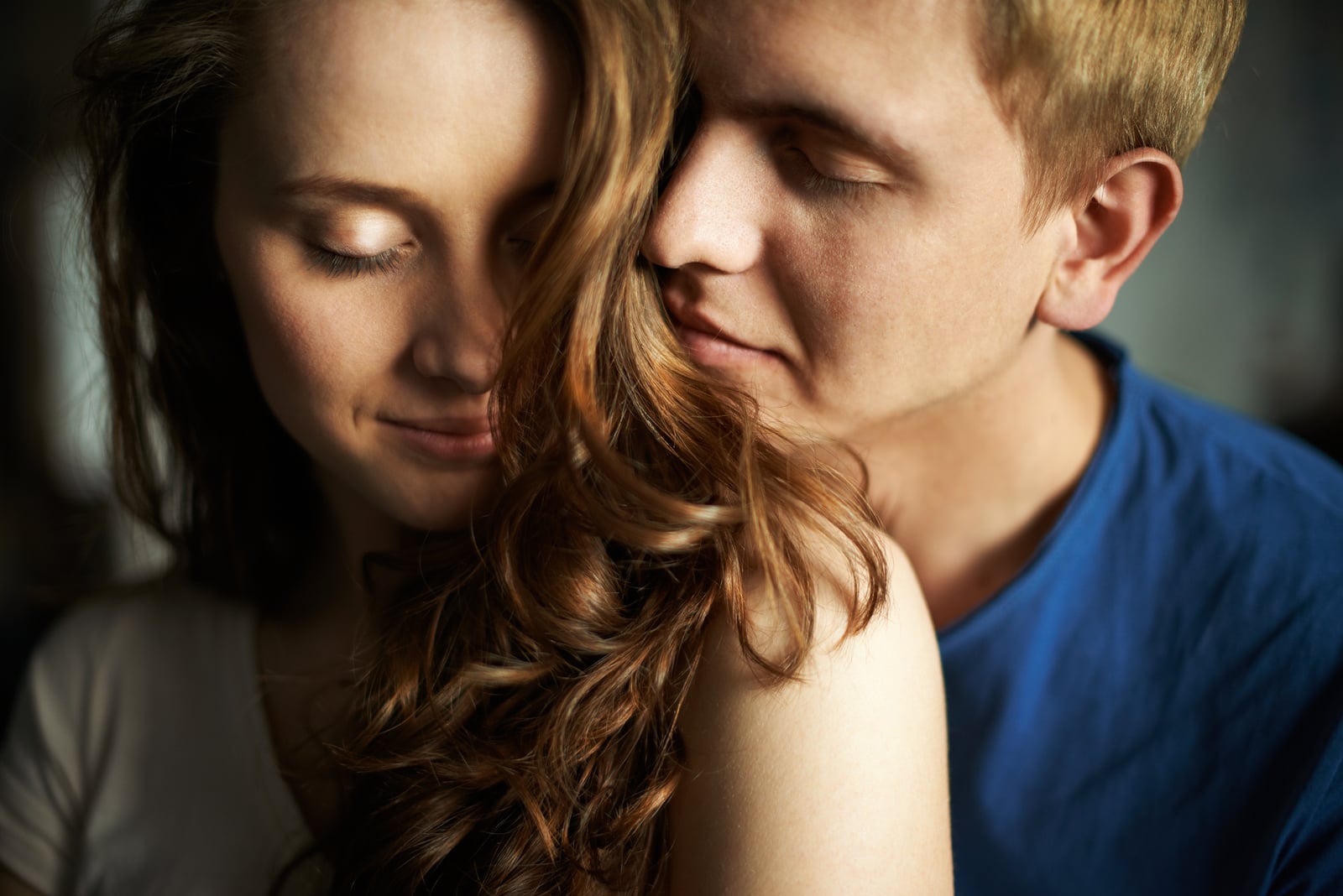 young man enjoying the smell of woman