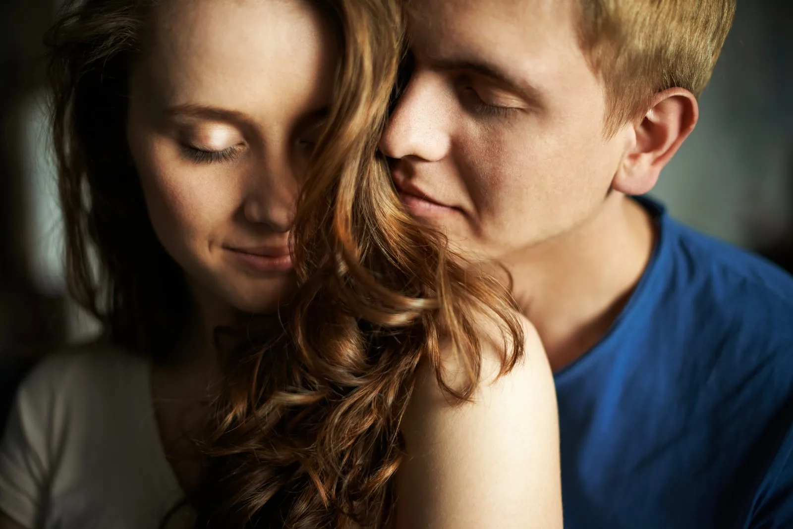 young man enjoying the smell of woman