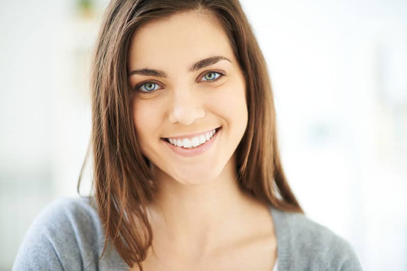 young woman smiling to camera