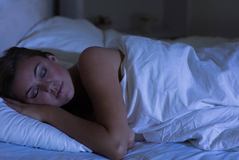 young woman taking sleeping at night
