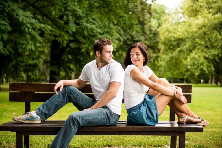 Young smiling couple looking on each other