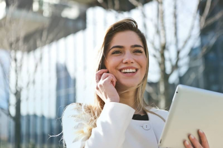 happz blonde woman with phone in hand
