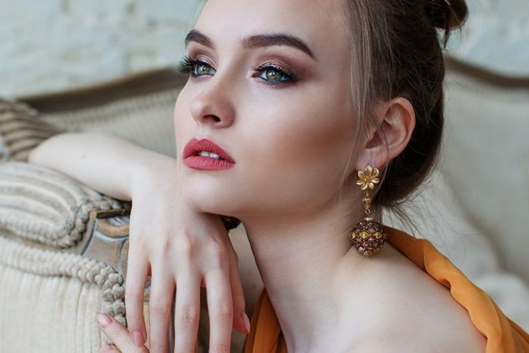attractive woman leaning on the sofa