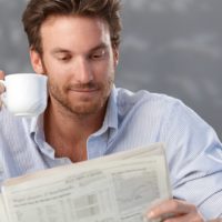 man reading newspaper