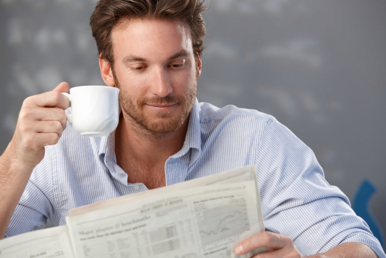 man reading newspaper