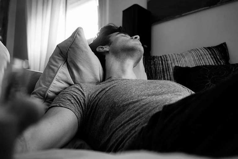 man lying on bed