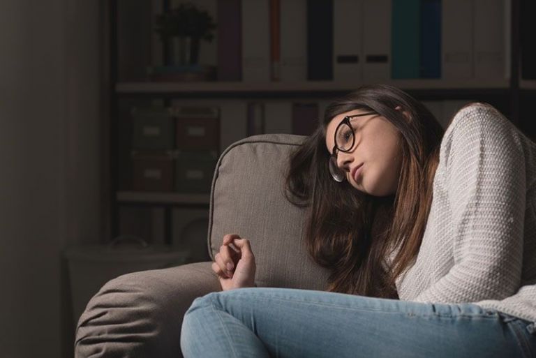 young worried woman sitting on the chair