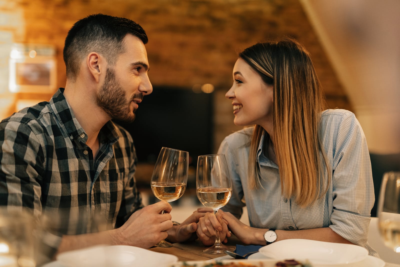 charming couple talking at dinner