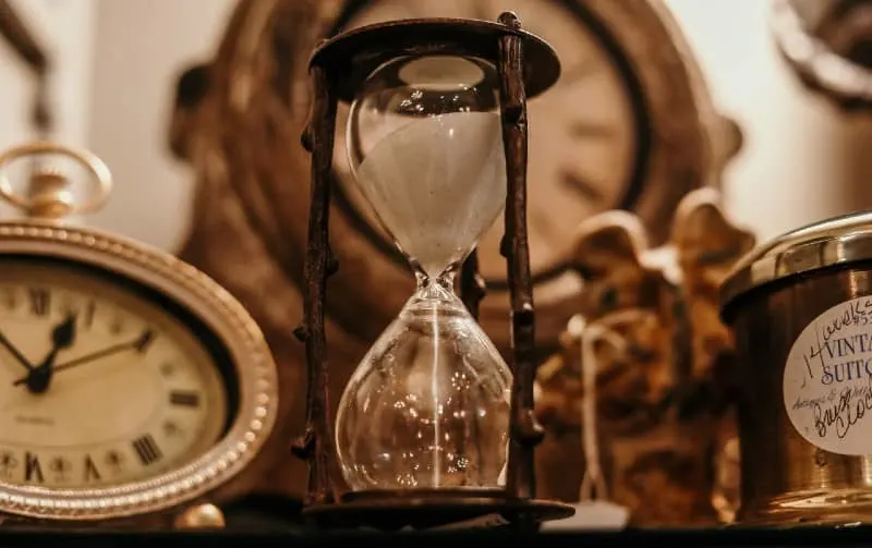 Vintage clocks and hourglass