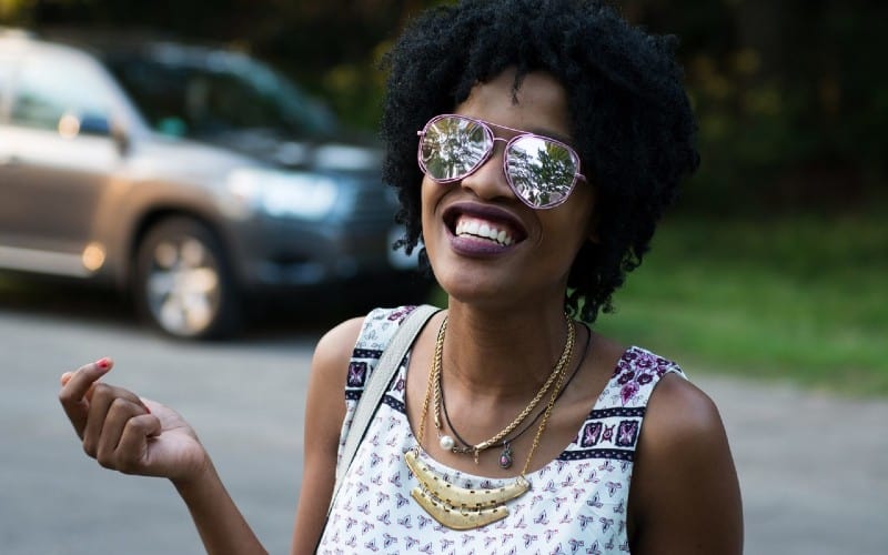 happy african american woman with sunglasses